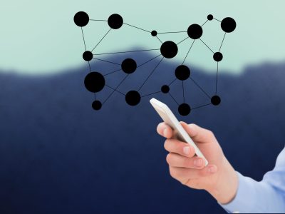 digital composite of hand holding smartphone with vignettes